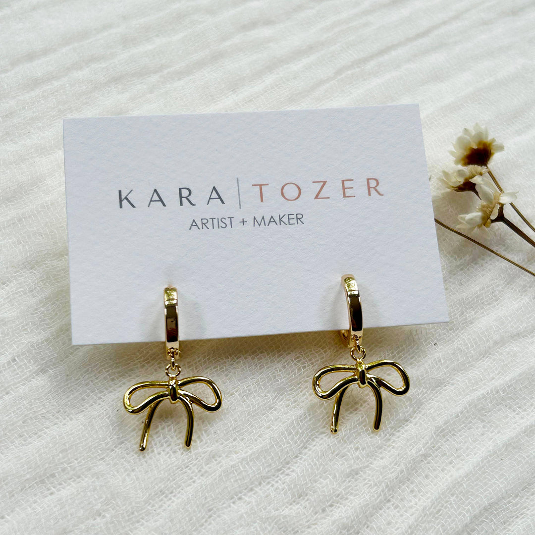 Gold Bow Charm Hoops KT797