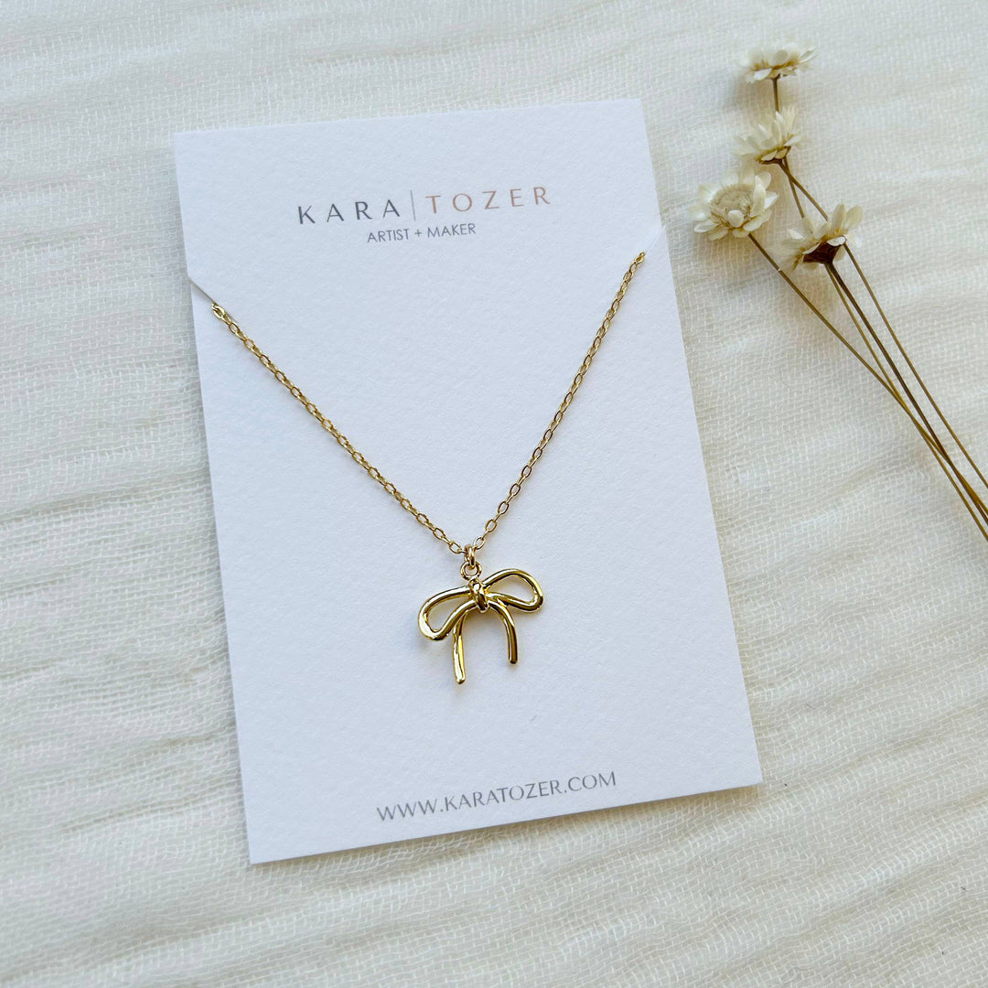 Gold Bow Charm Necklace KT26